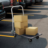 Blau-weißer Plattformwagen CARRY mit drei geladenen Pappkartons auf einem Parkplatz von hjh OFFICE