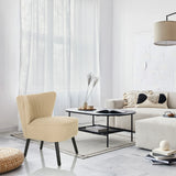 Beige Lepotuoli MANISO mustilla jaloilla modernisti sisustetussa huoneessa, valmistaja hjh LIVING