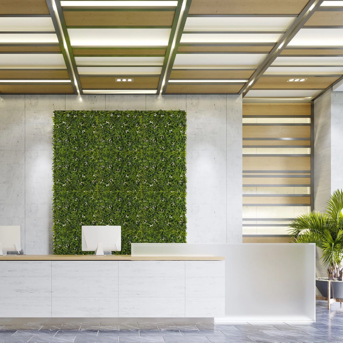 Vihreä kasvimatto MORE GREEN I pystysuorana viherseinänä vaalealla betoniseinällä vastaanottotilassa, valmistaja hjh OFFICE